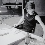 photo of Edie Sedgwick at a drawing table