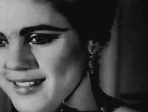 Still frame from Andy Warhol's Poor Little Rich Girl shot at Edie Sedgwick's apartment in New York in March and April 1965. Black-and-white film of Sedgwick getting ready for an evening out.