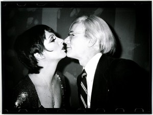 black-and-white photo of Liza Minnelli and Andy Warhol kissing