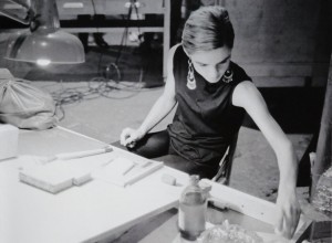 photo of Edie Sedgwick at a drawing table