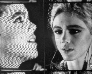Frame from Andy Warhol's Outer and Inner Space featuring a filmed Edie Sedgwick in front of a video Edie Sedgwick on a TV monitor